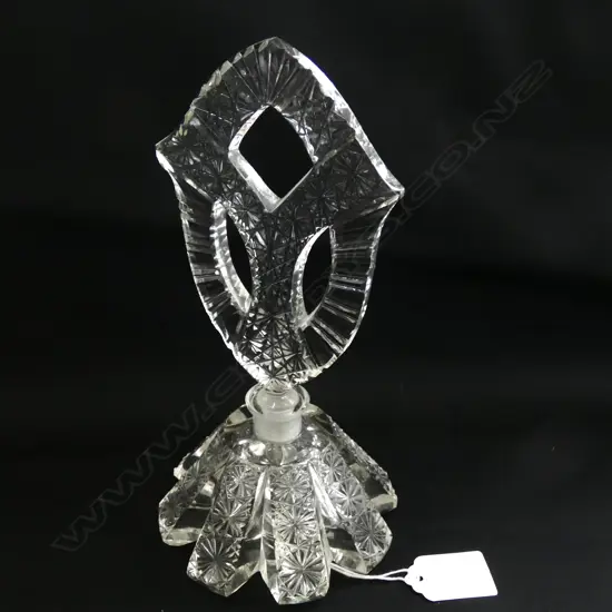 A PERFUME BOTTLE, CLEAR GLASS, PADDLE STOPPER