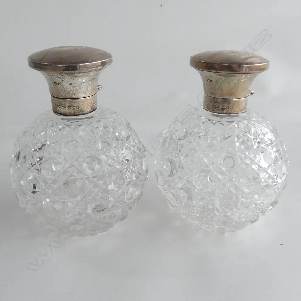 PAIR CUT CRYSTAL PERFUME BOTTLES W SILVER TOPS, LONDON 1904. H.120mm. Image 1++