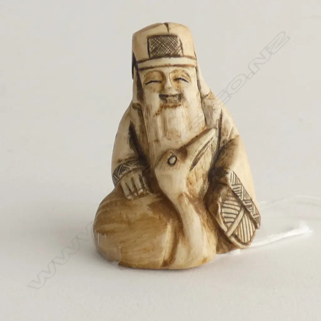 JAPANESE CARVED IVORY NETSUKE; GOD OF FORTUNE H.50mm Image 1++