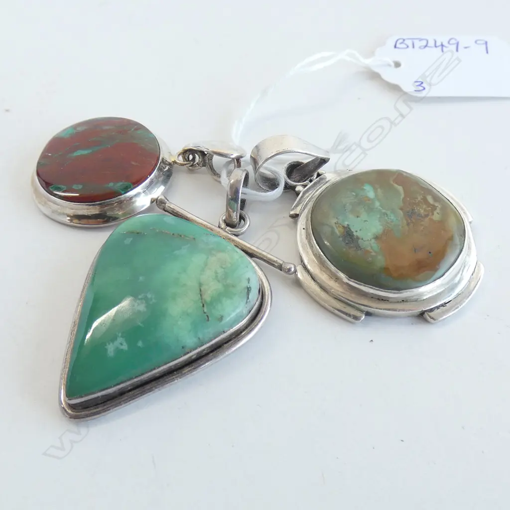 THREE SILVER AND GEMSTONE PENDANTS Image 1++