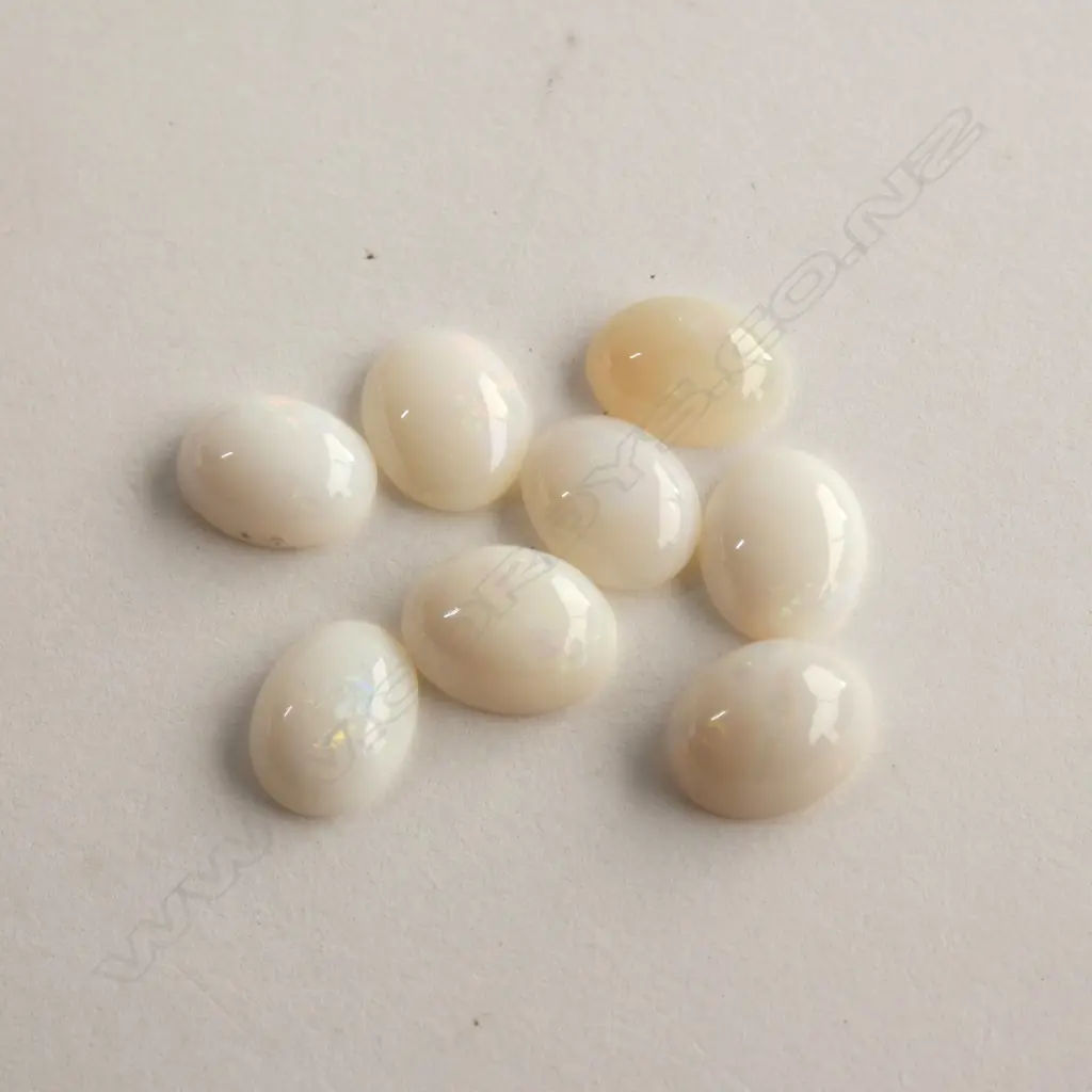 EIGHT OVAL MILKY OPAL STONES 9.45CT Image 1++