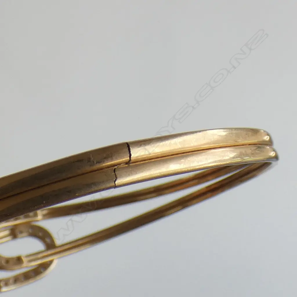 9CT GOLD AND CZ BANGLE (very delicate crack to the base) 5.11gm Image 1++