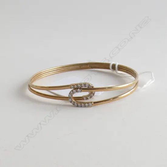 9CT GOLD AND CZ BANGLE (very delicate crack to the base) 5.11gm