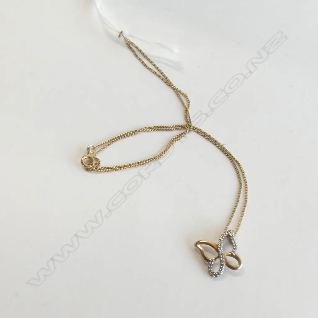 9CT GOLD & DIAMOND BUTTERFLY PENDANT ON SILVER GP CHAIN Image 1++