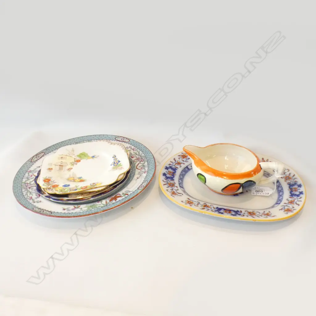 CLARICE CLIFF SMALL JUG + 6 ASST. PLATES Image 1++