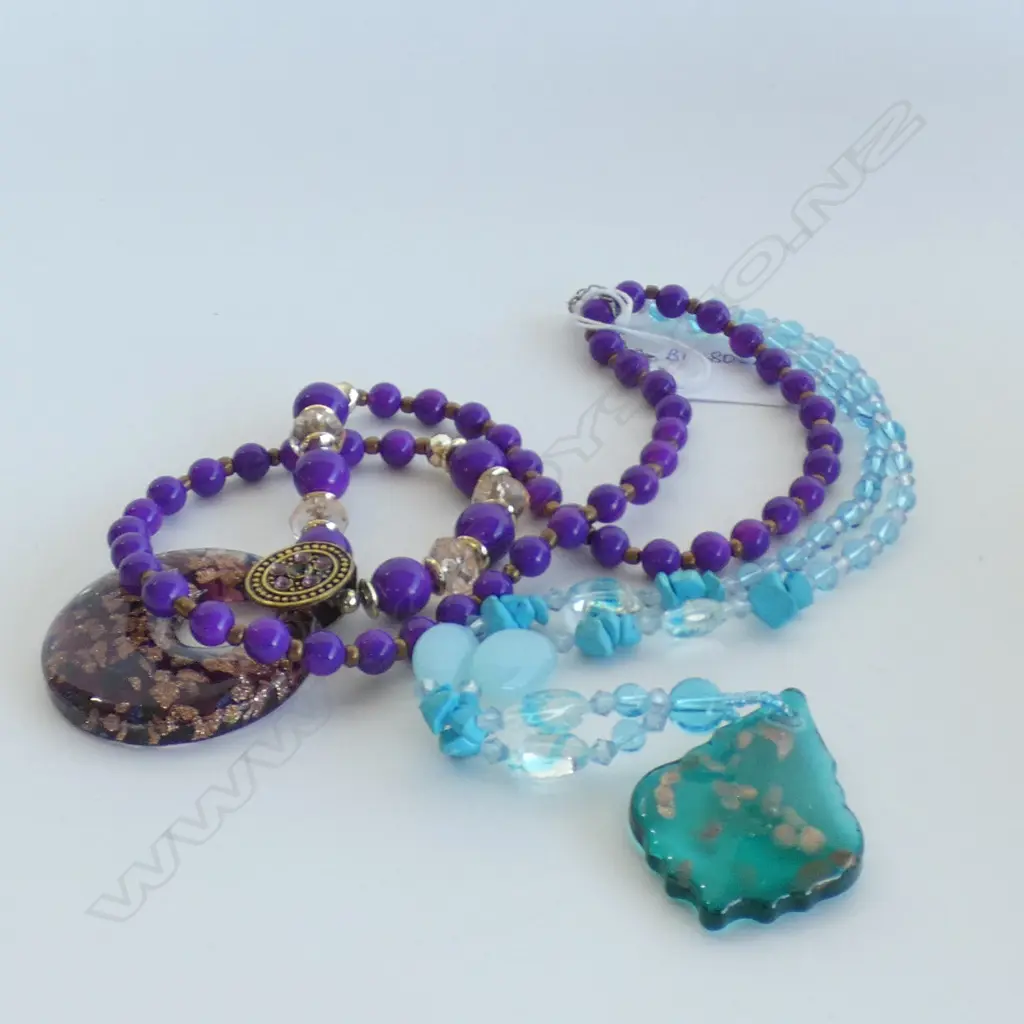 TWO GLASS NECKLACES Image 1++