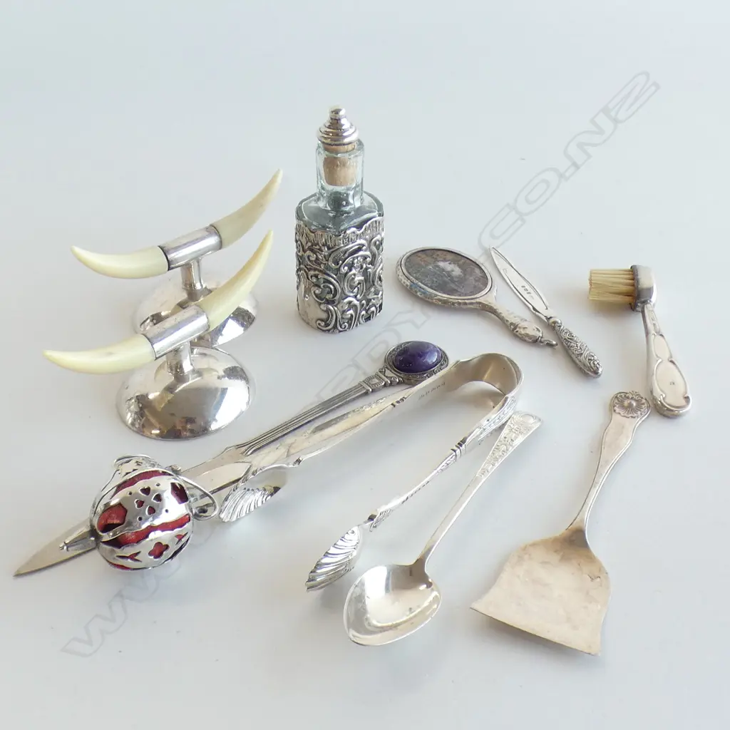 ASST. STG SILVER ITEMS; TONGS, BOTTLE, SWORD LETTER OPENER + EP KNIFE RESTS ETC Image 1++