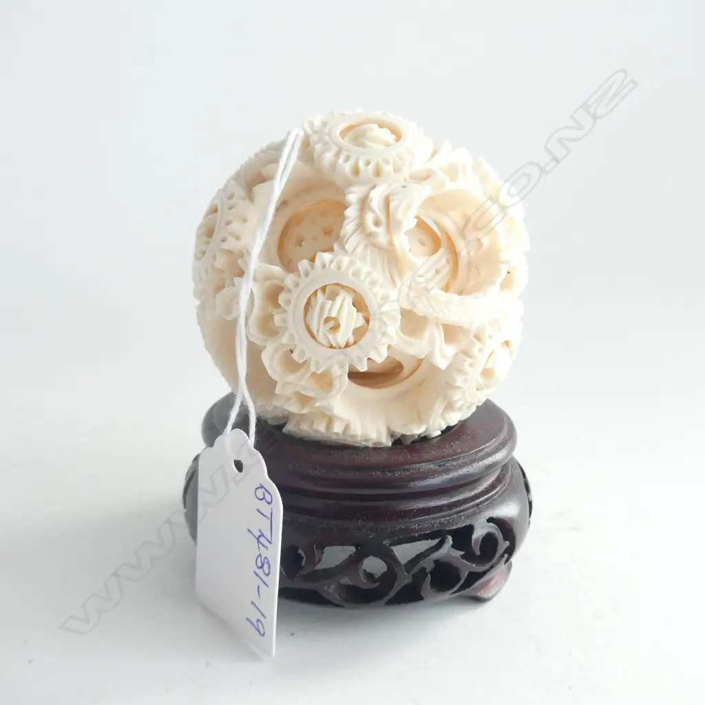 UNUSUAL CARVED IVORY PUZZLE BALL WITH WITH 12 MINIATURE PUZZLE BALLS TO TOP LAYER ON CARVED WOOD STAND Image 1++