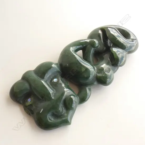 zoomorphic carving with whale tail