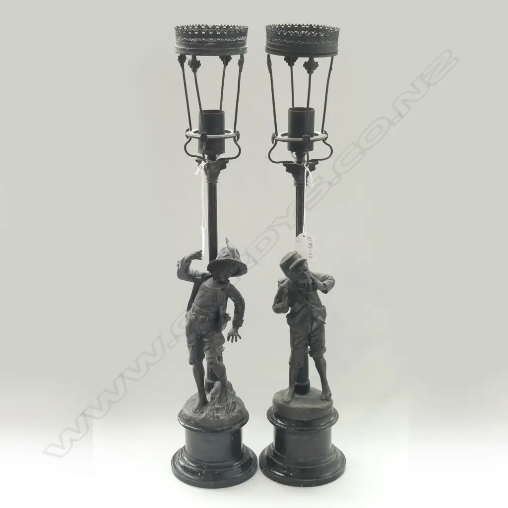 PAIR SPELTER FIGURAL LAMPS.DEPICTING A MESSAGE BOY AND POSTBOY BY A STREETLAMP 590MM HIGH SANS SHADES Image 1++