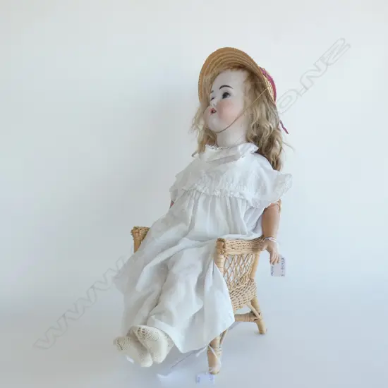GERMAN SCHOENAU & HOFFMEISTER PORCELAIN DOLL - JOINTED ARMS & LEGS  (L 600MM) C1909  - WITH CANE CHAIR 