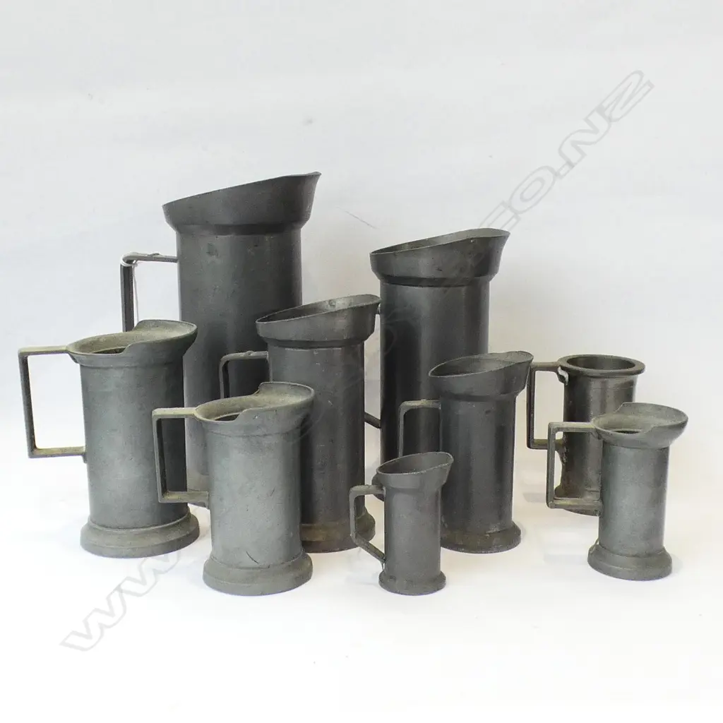 GRADUATING SET OF 9 CONTINENTAL PEWTER MEASURES; 1L TO 2 CENTILITRES H.200mm Image 1++