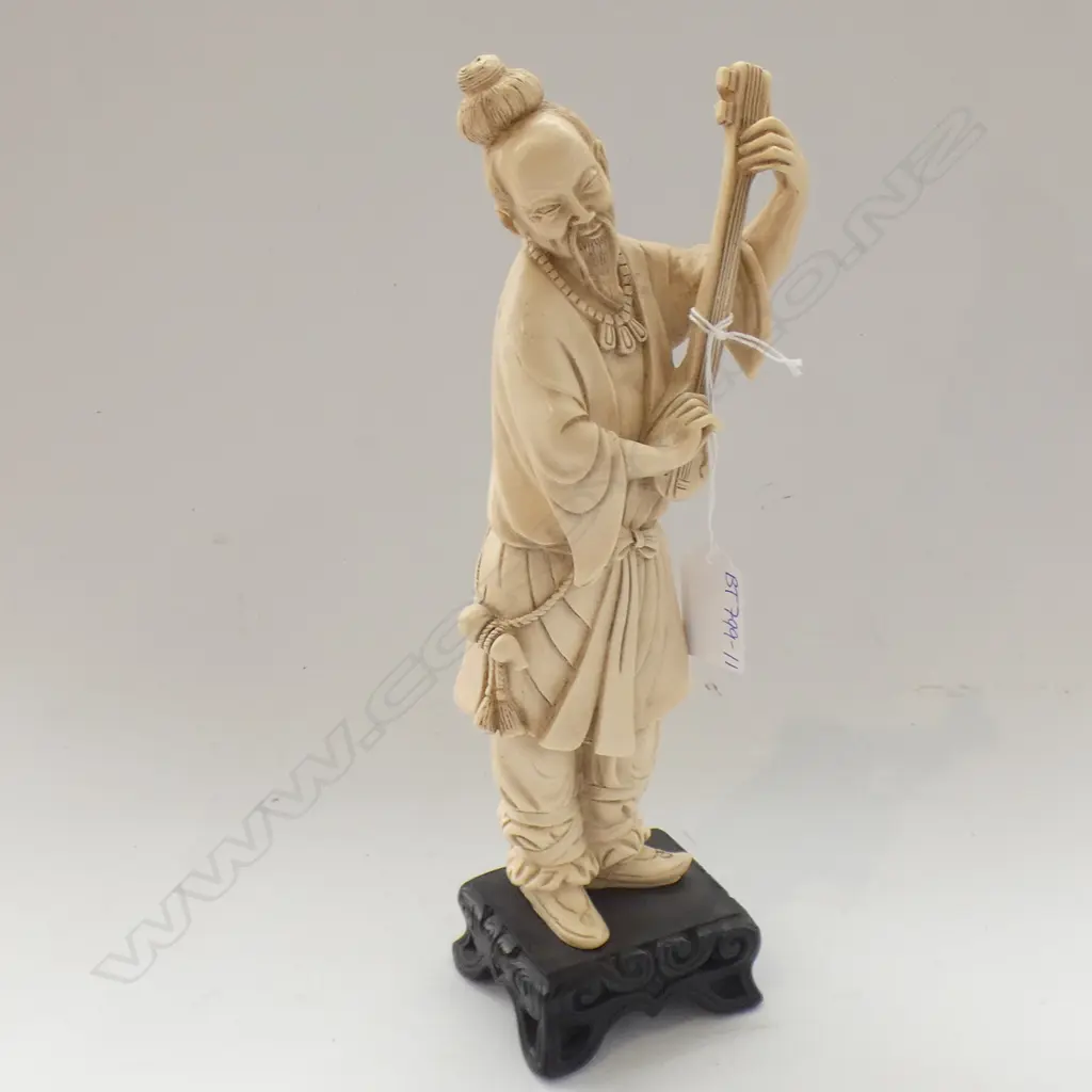 ORIENTAL RESIN FIGURE ON WOODEN STAND; MAN PLAYING INSTRUMENT H 275MM Image 1++