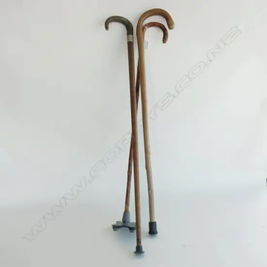 3 OLD WOODEN WALKING STICKS INCL ONE WITH SILVER BAND & ONE CANE W NON SKID PAD