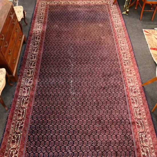 LGE HAND KNOTTED PERSIAN CARPET w OLD MAPLE & Co RETAILER'S LABEL. (AF)...