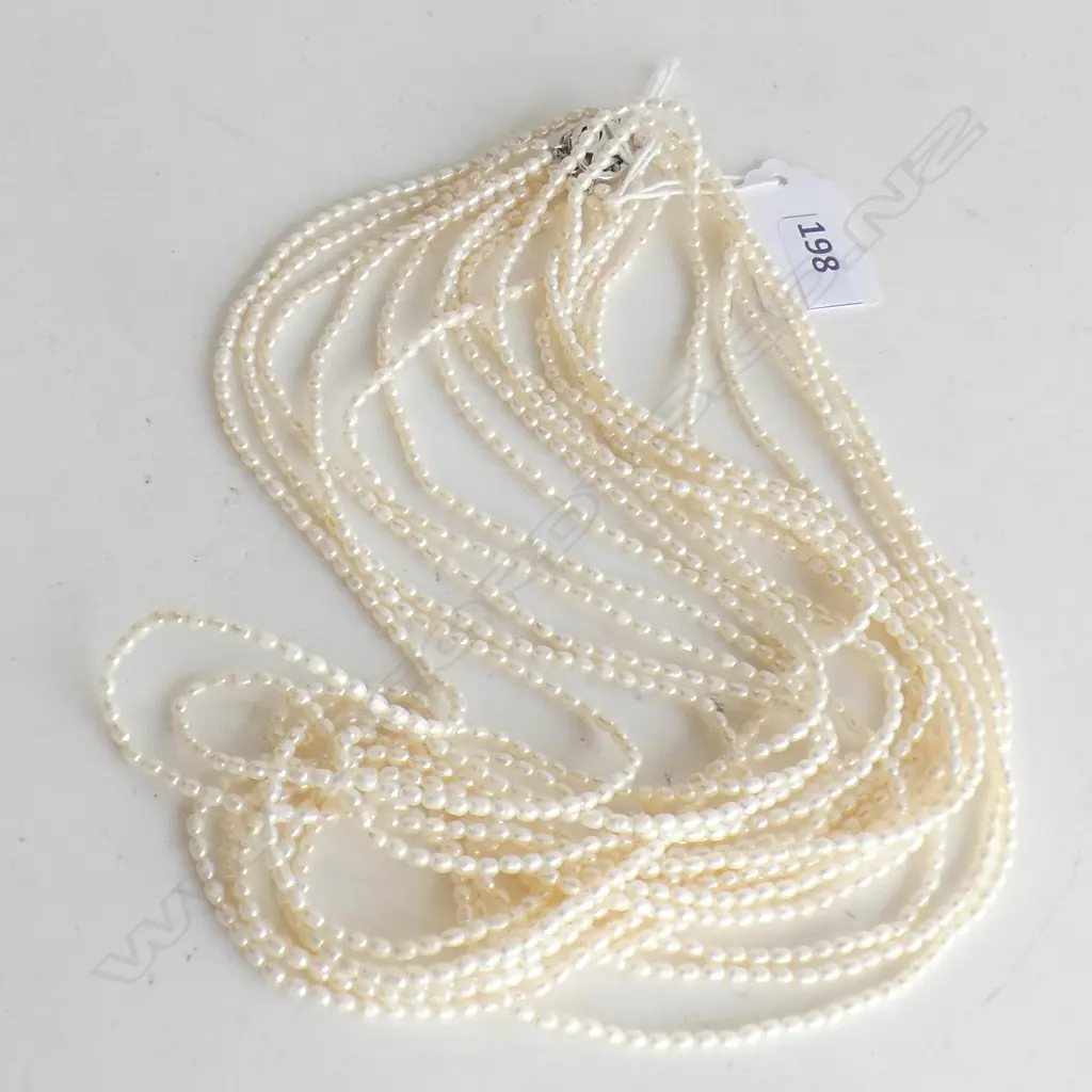 9 STRING SEED PEARL NECKLACE WITH ORNAMENTAL CLASP Image 1++