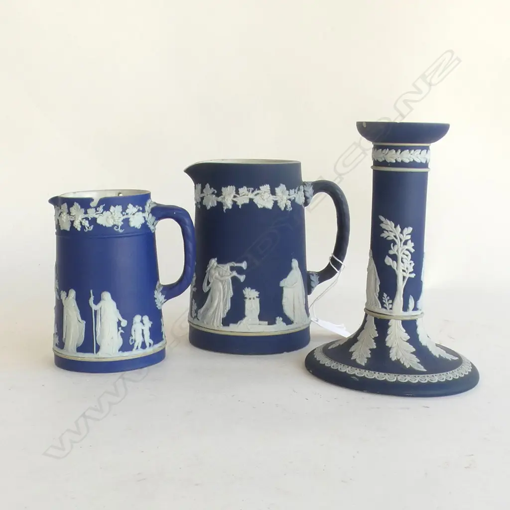 3 PCS WEDGWOOD COBALT JASPERWARE; 2 JUGS (LARGEST H 135MM) & CANDLESTICK (H 165MM) minor chips Image 1++