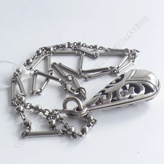 SILVER ? LONG FANCY CHAIN WITH PIERCED LGE PENDANT