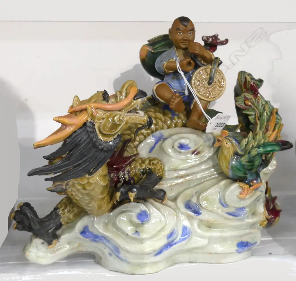 CHINESE 'MUDMAN' CERAMIC; MAN ON DRAGON W.300mm minor loss Image 1++