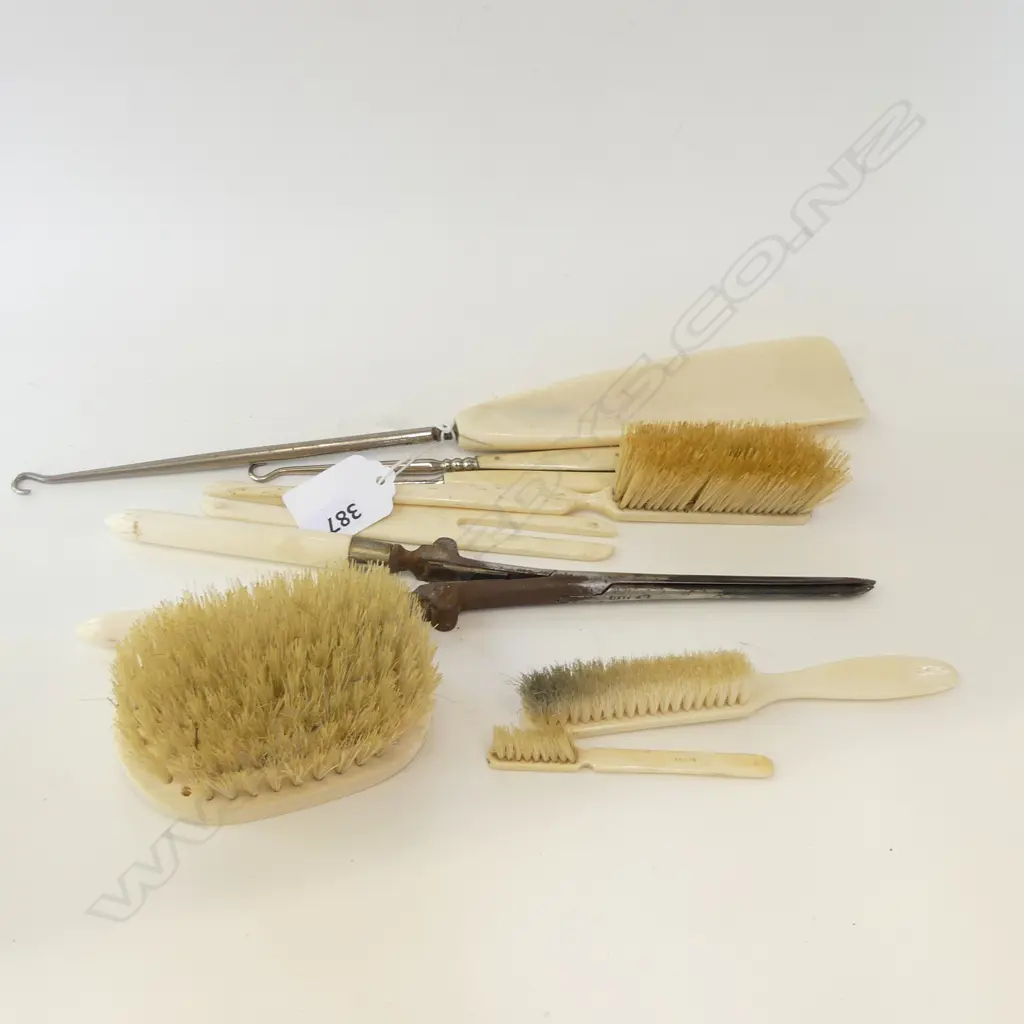 COLLECTION OF IVORY & BONE BACKED BRUSHES, CURLING TONGS, SHOEHORN, ETC. Image 1++