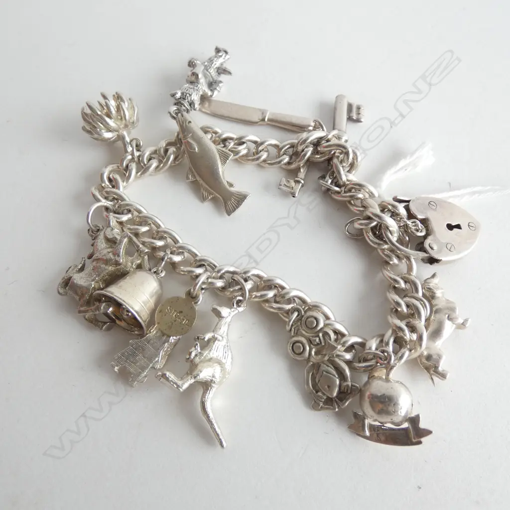 SILVER CHARM BRACELET WITH 13 CHARMS 52gm Image 1++