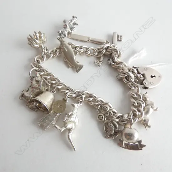 SILVER CHARM BRACELET WITH 13 CHARMS 52gm