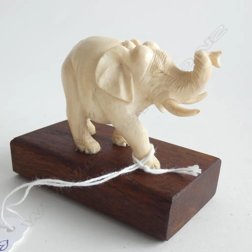 FINELY CARVED IVORY ELEPHANT ON WOOD STAND Image 1++
