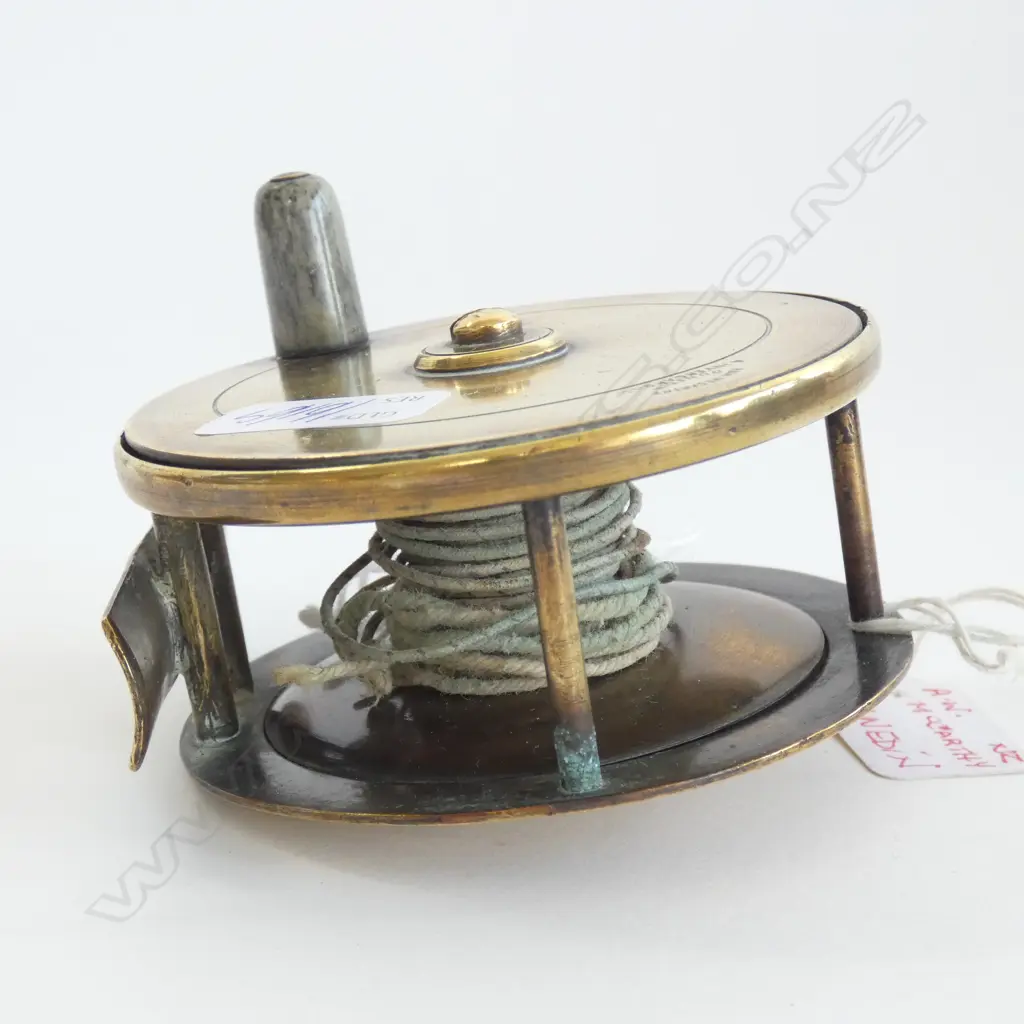 (16169) A & W MCCARTHY DUNEDIN OLD BRASS ENCASED FISHING REEL - DIA  80MM Image 1++