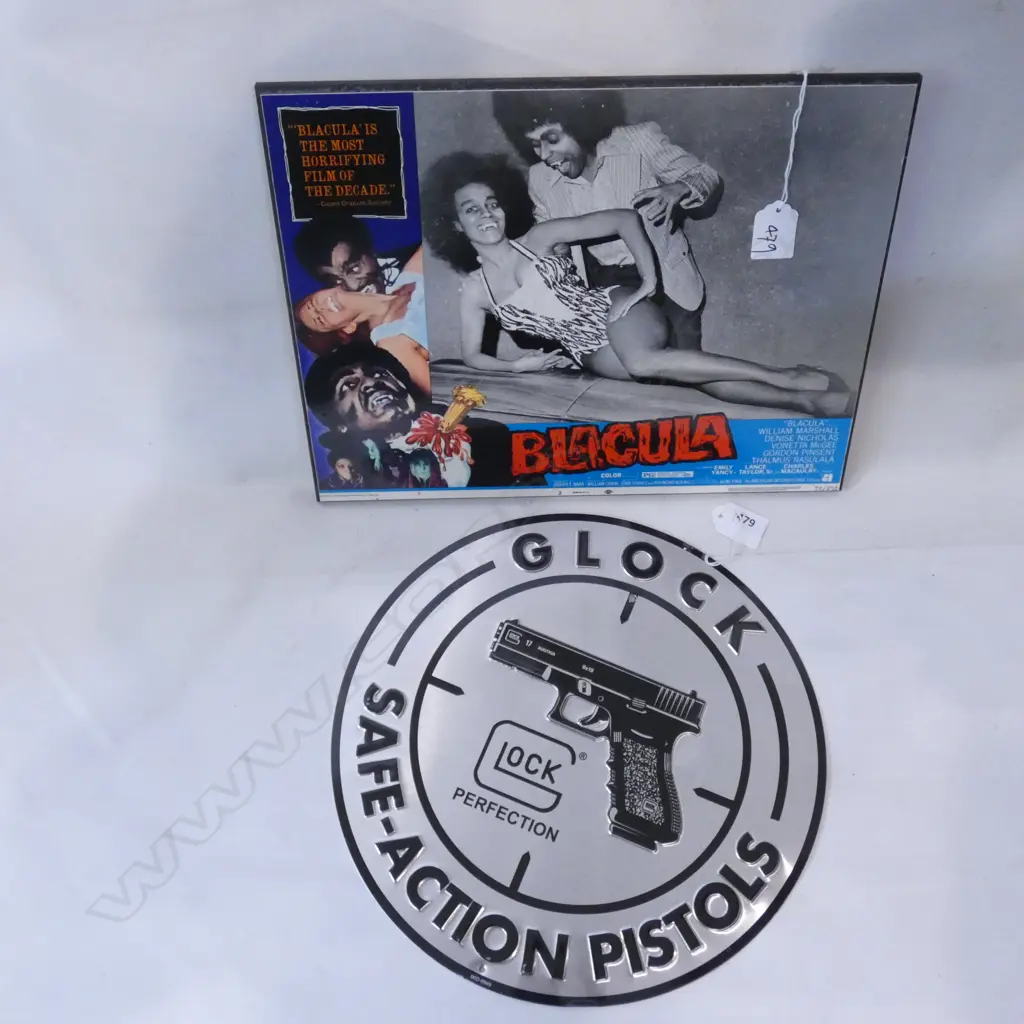 MOUNTED OLD 'BLACULA' POSTER (350 X 280MM) & TIN PLATE GLOCK PISTOL ROUND SIGN (DIA 300) Image 1++