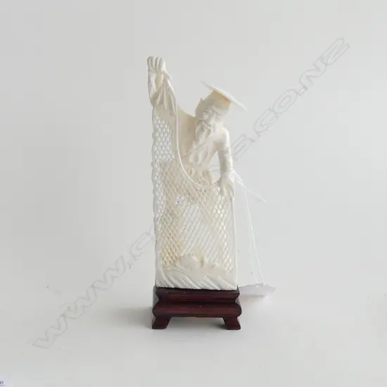 CARVED IVORY ORIENTAL FISHERMAN WITH NET, ON WOODEN STAND, H. 150MM