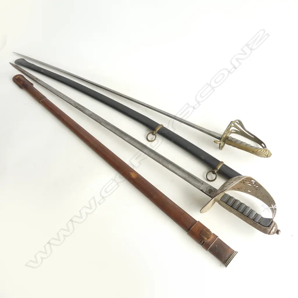 TWO BLADED WEAPONS ONE PARADE GROUND SWORD EDWARD VIIth PERIOD (SOME RUST) IN SCABBARD PLUS MIDDLE EASTERN SABRE ALSO Image 1++