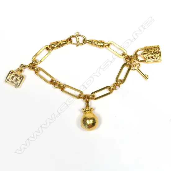 23 CT GOLD BRACELET w. CHARMS 30.15 GRAMS