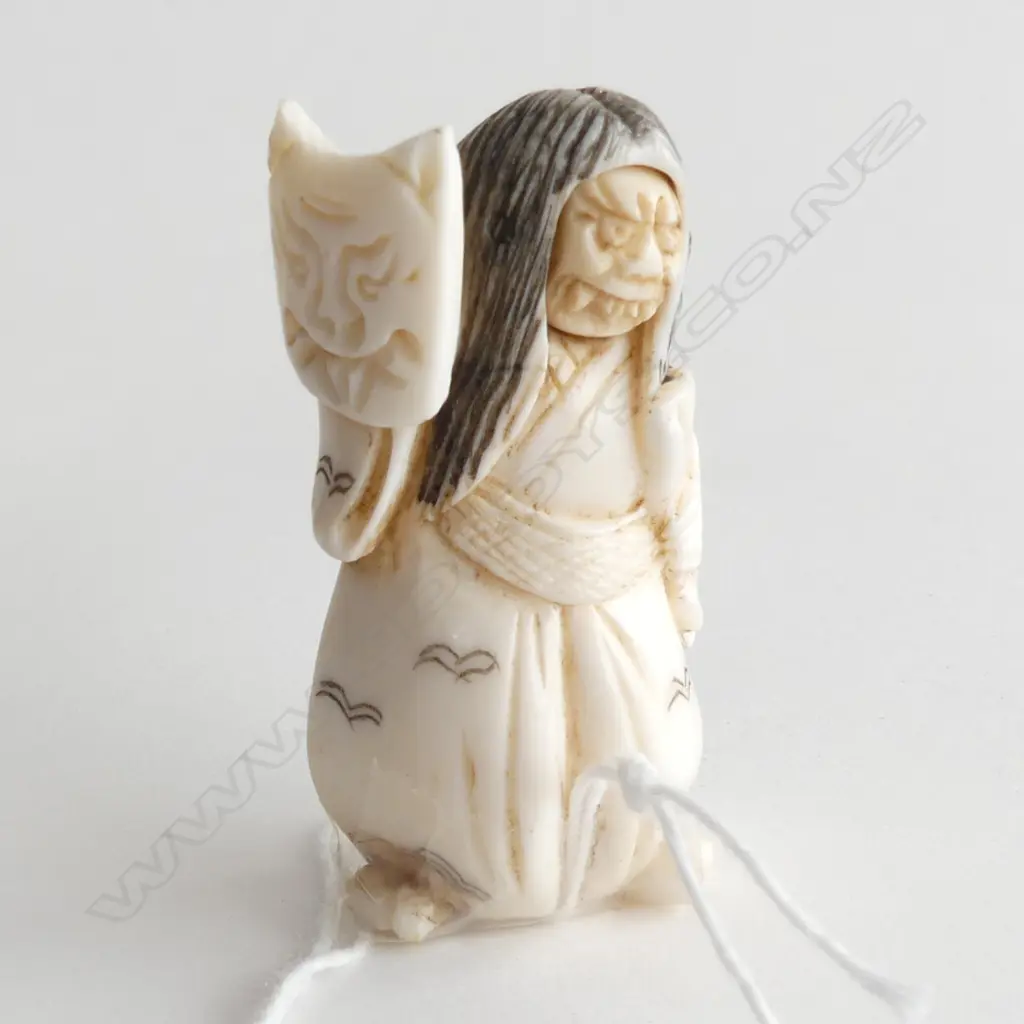 FINELY CARVED IVORY NETSUKE, 2 FACED WOMAN (FACE SPINS TO REVEAL HAPPY & MEAN FACE), H 50MM Image 1++