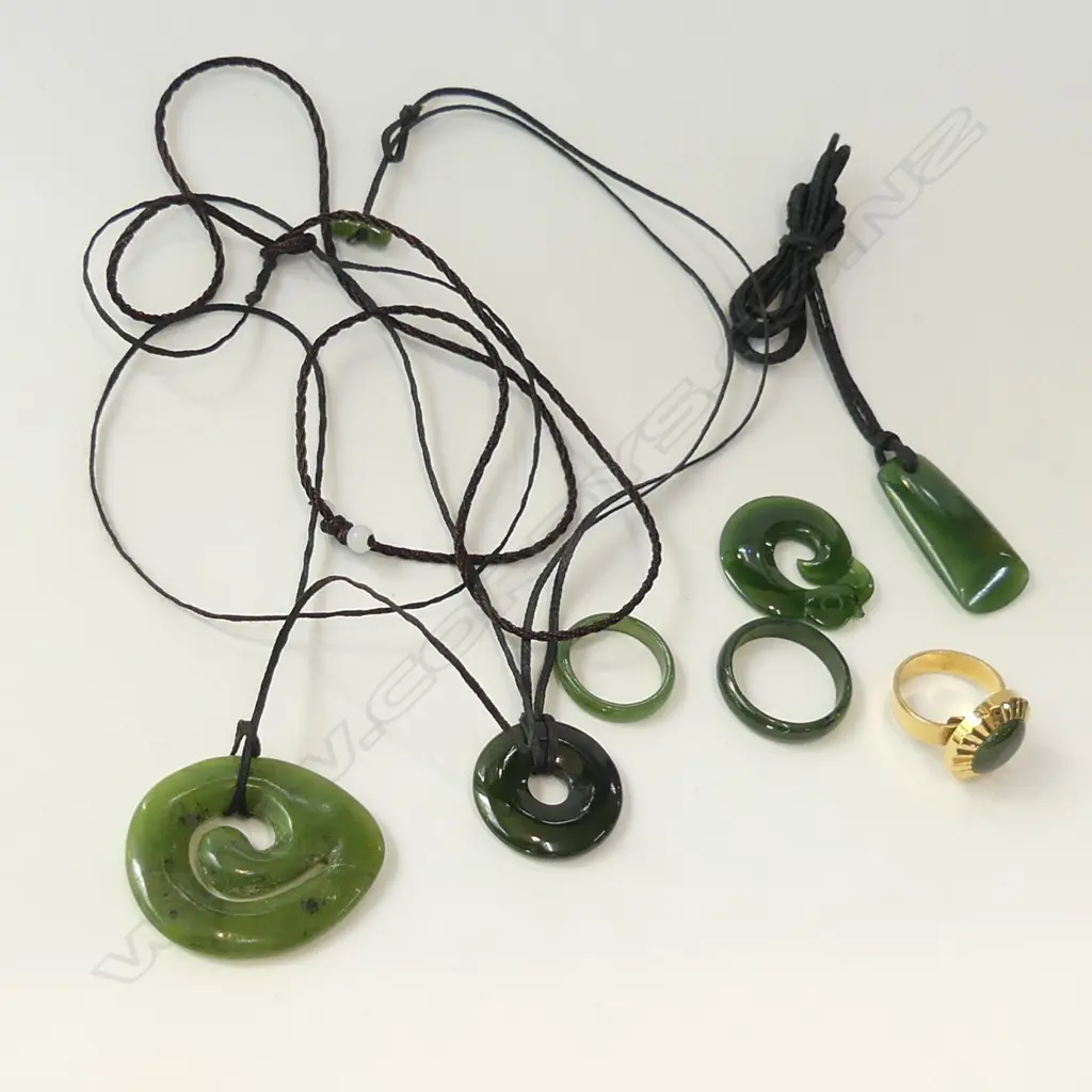 ASST GREENSTONE JEWELLERY; 2 SOLID RINGS, 1 GOLDTONE RING & 4 POUNAMU ON CORDS Image 1++
