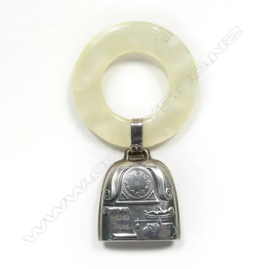 A mid 20thC silver and simulated mother of pearl baby rattle,