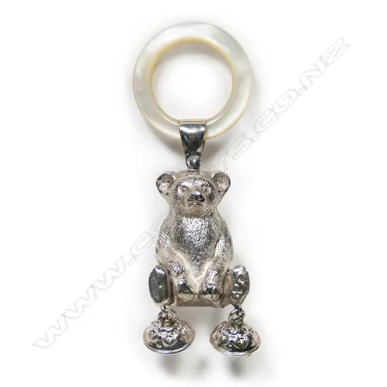 A silver and mother of pearl baby rattle,