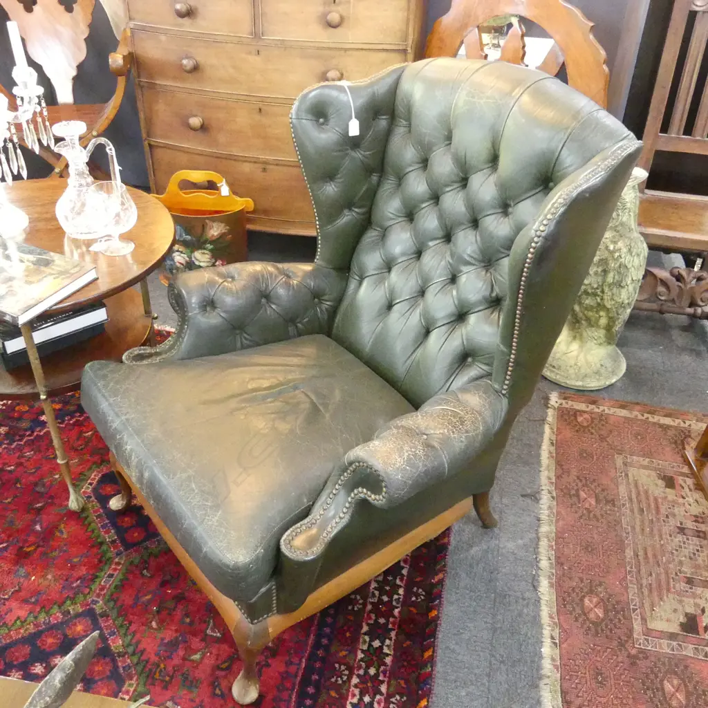 GREEN LEATHER WING BACK CHAIR SHOWING WEAR Image 1++