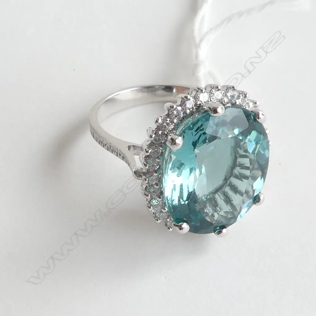 SILVER RING WITH TOPAZ STYLE STONE AND CZs, SIZE O Image 1++