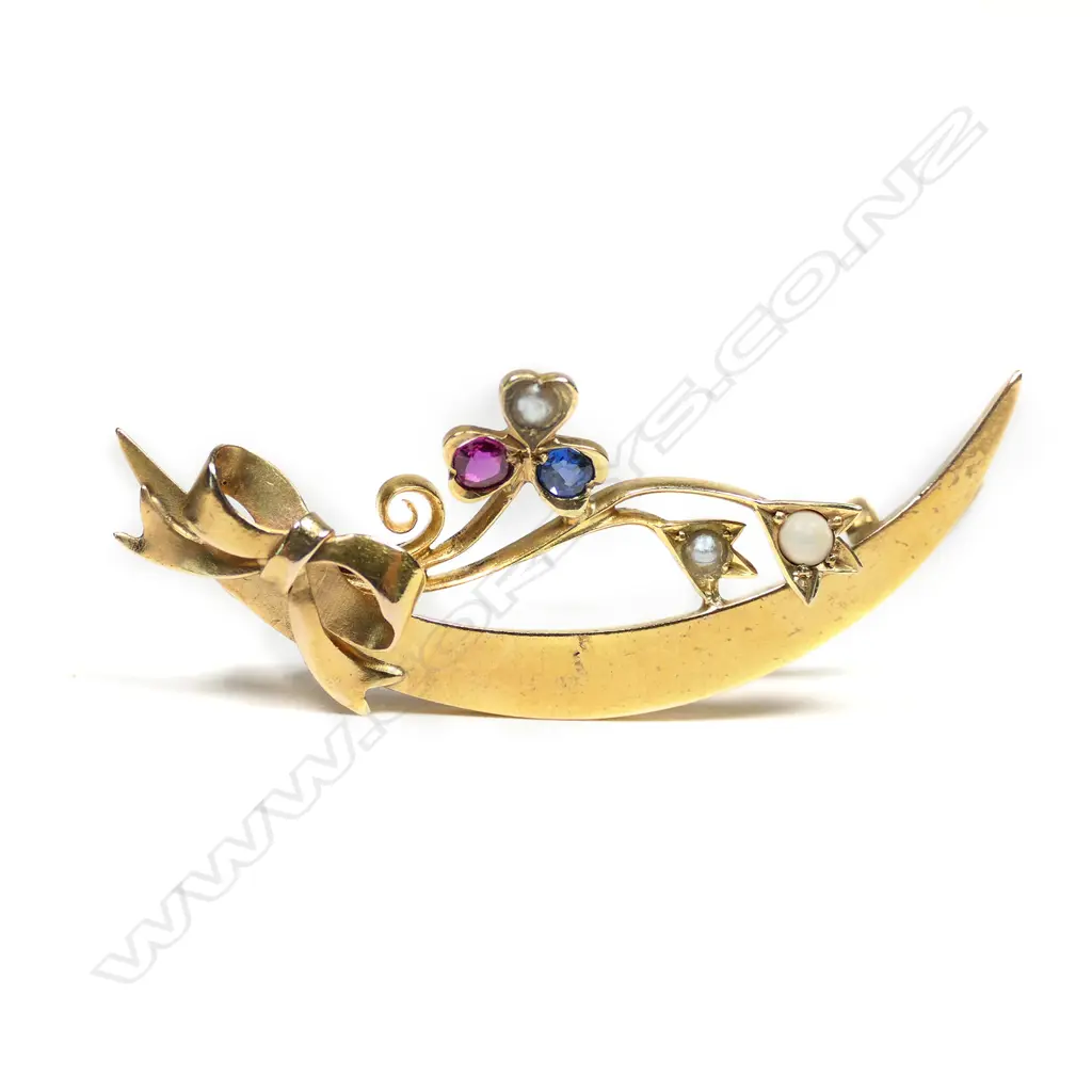 An Edwardian 15ct gold seed pearl ruby and sapphire crescent brooch, Image 1++