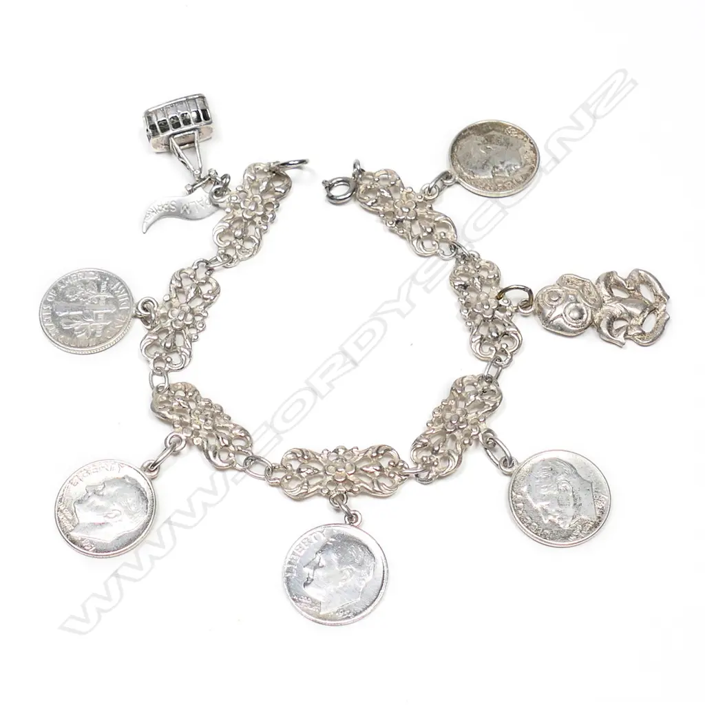 An .800 silver American multi one dime charm bracelet, Image 1++