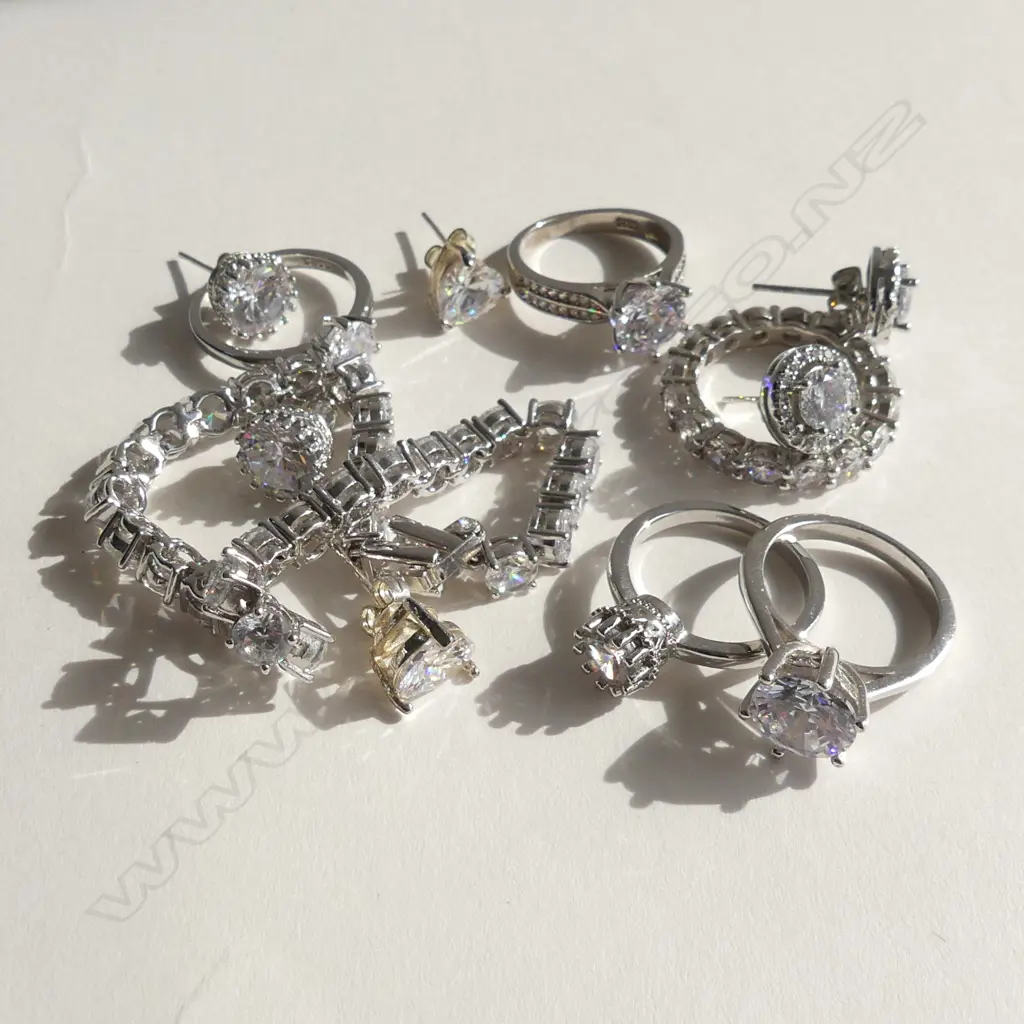 ASST. STG SILVER & FAUX DIAMOND JEWELLERY; 5 RINGS, BRACELET, 3 PRS EARRINGS 36gm. Image 1++