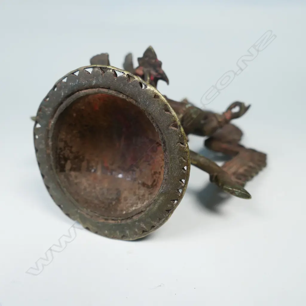 AN INDIAN BRONZE STATUETTE, A FIGURE WITH HANDS IN GYAN MUDRA SEATED BENEATH AN ARCH, ON DOMED PLINTH BASE… Image 1++