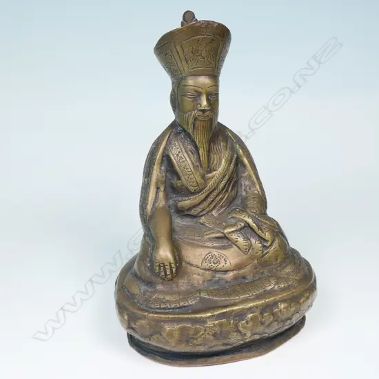MONGOLIAN SCHOOL BRONZE STATUE OF AN UNIDENTIFIED LAMA, SEATED IN BHUMISPARSHA MUDRA...