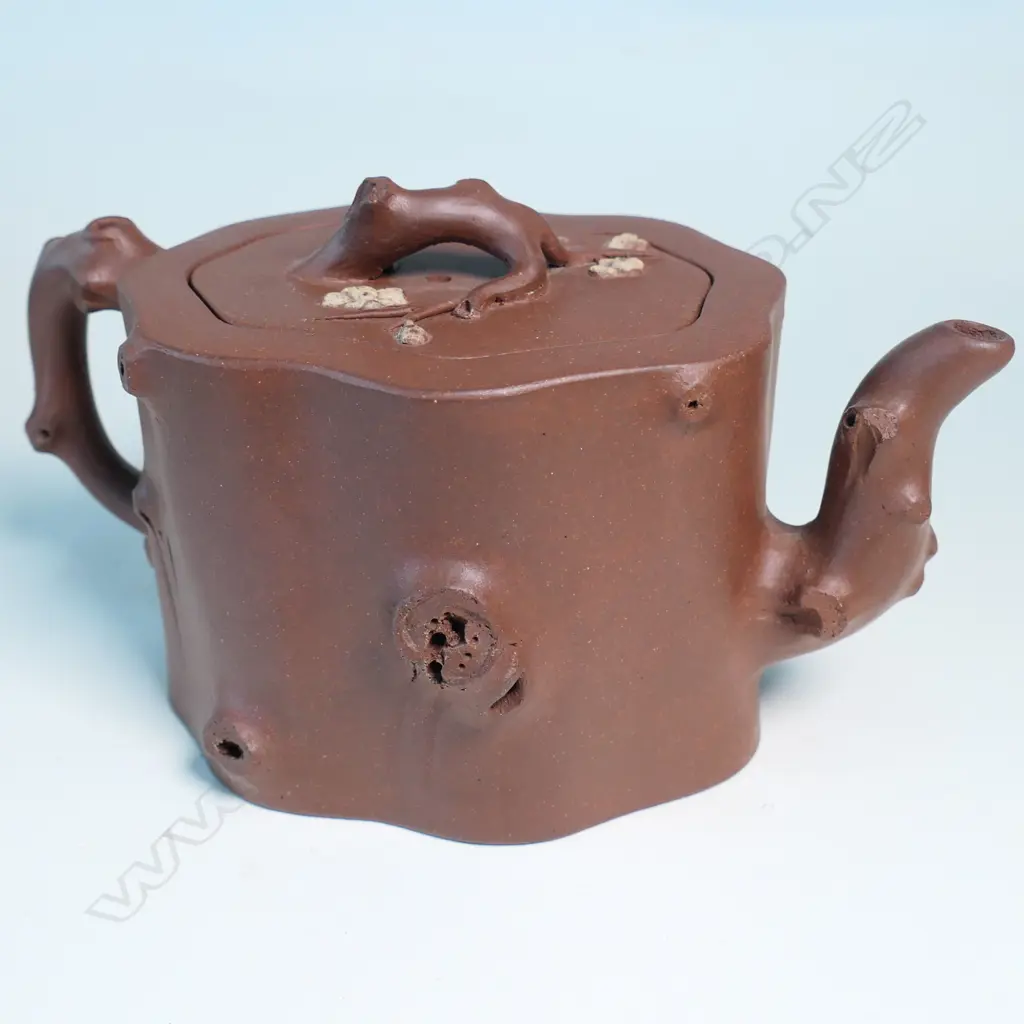 YIXING TEAPOT, MARKED 雲山吳製 (YUN SHANWU), NATURALISTICALLY MODELLED AS A CHERRY TREE TRUNK SECTION... Image 1++