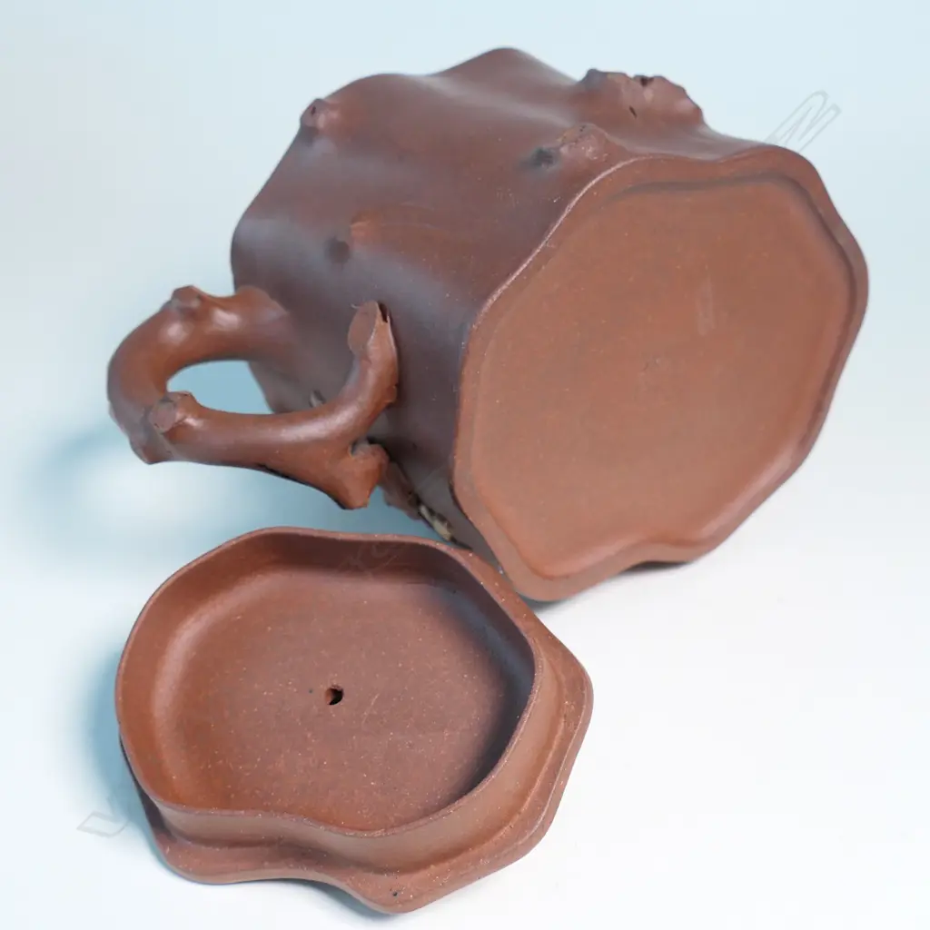 YIXING TEAPOT, MARKED 雲山吳製 (YUN SHANWU), NATURALISTICALLY MODELLED AS A CHERRY TREE TRUNK SECTION... Image 1++