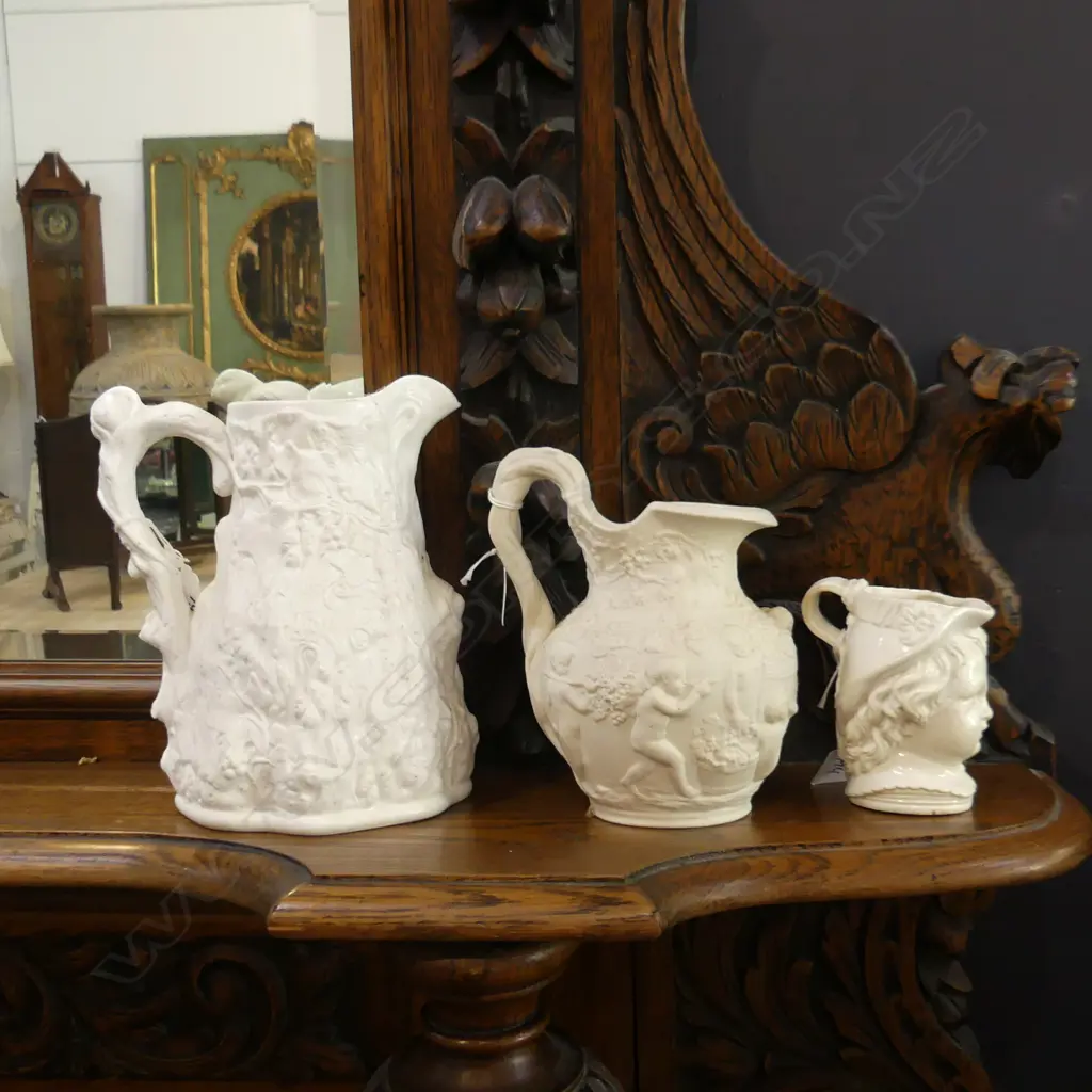 2 PARIAN WARE CHERUB & CHILDREN EMBOSSED JUGS INCL 1 COPELAND (H.215 & 185mm) + SM OLD JUG W CHILD'S FACE  (A.F.) (H.115 Image 1++