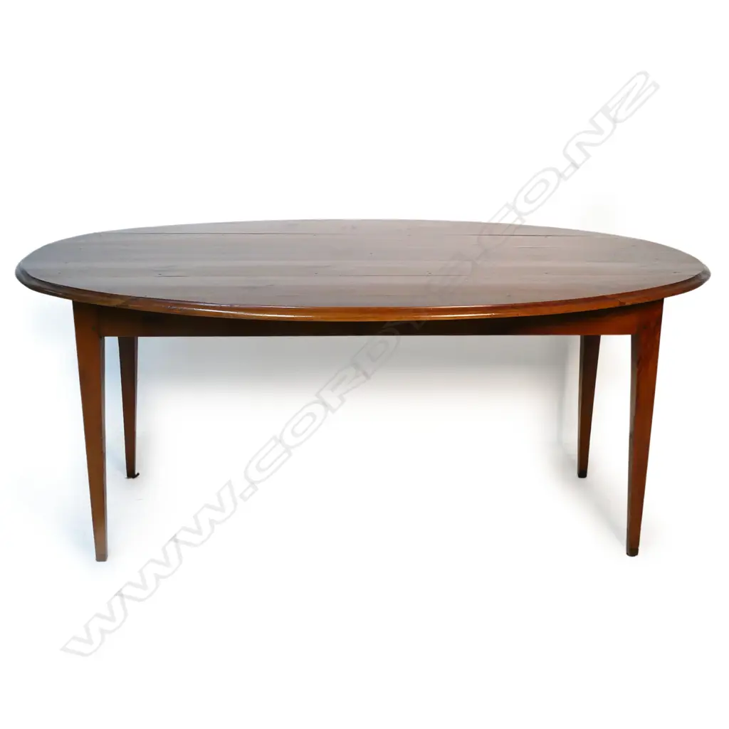 A 19thC French oval, fruitwood plank top table, Image 1++