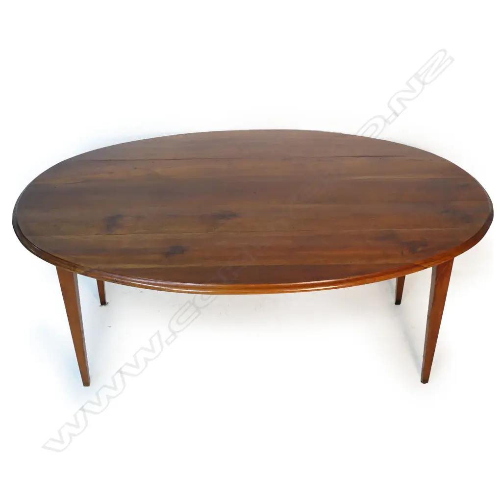 A 19thC French oval, fruitwood plank top table, Image 1++
