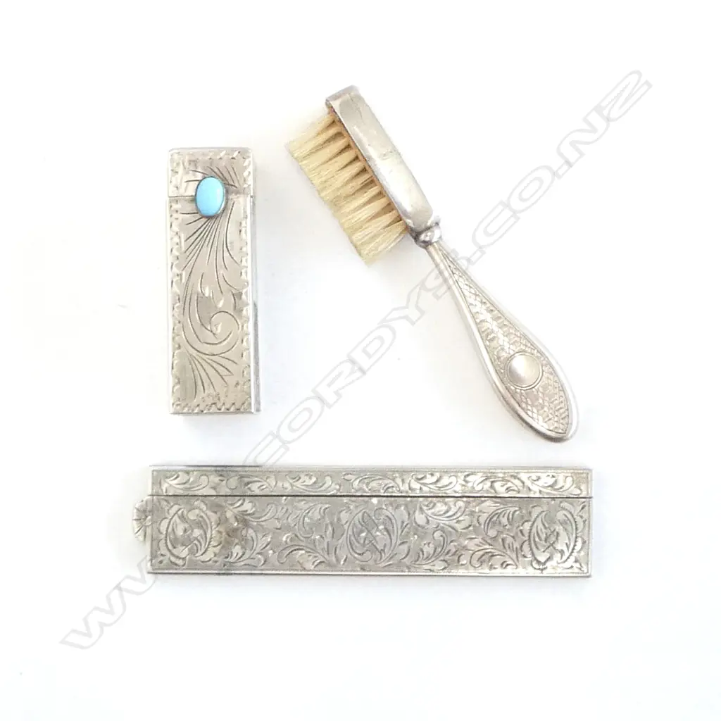 A silver handled toothbrush, a silver comb case and an 800 silver lipstick case with sprung mirror. Image 1++