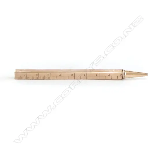 A 9ct gold cased telescoping propelling pencil with engraved ruler scales,